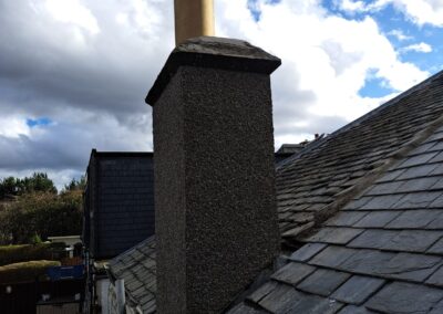 Chimney stack after repair on a slate roof