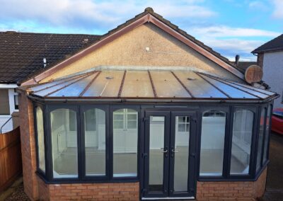 Conservatory roof conversion finished in dark tiles