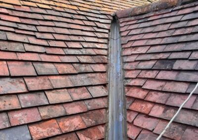 Old clay tile roof with slipped tiles
