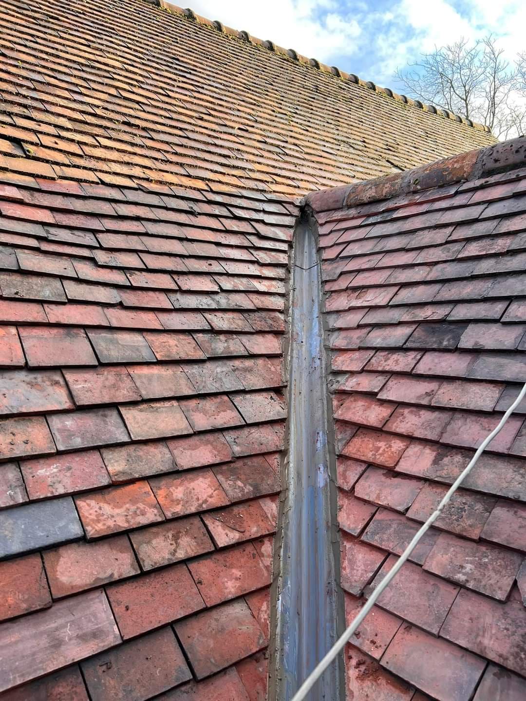 Old clay tile roof with slipped tiles