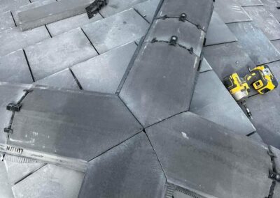 Slates refixed on a damaged roof