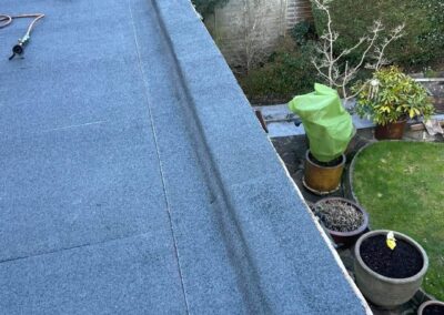 New flat roof with trims on an extension