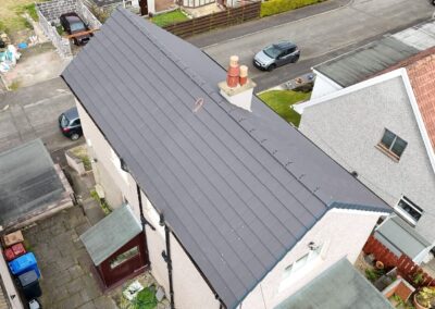 Re-roofed house with new grey tiles