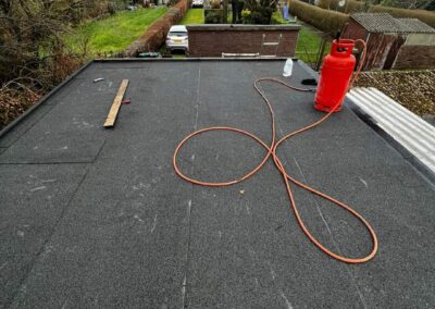Flat roof being replaced with torch-on felt