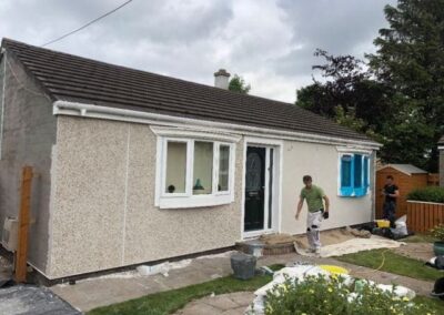 Bungalow finished in new white roughcast