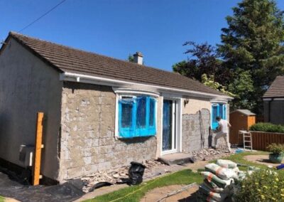 Bungalow walls stripped back before roughcasting