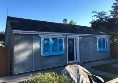 Fresh roughcast going on to a bungalow